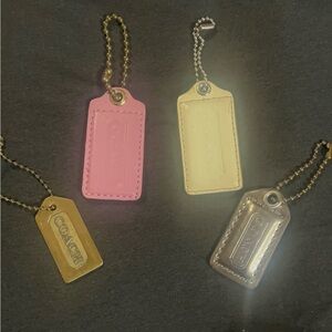 Coach Four-Piece Leather and Metal Tag Set in Pink, Cream, Gold, Silver